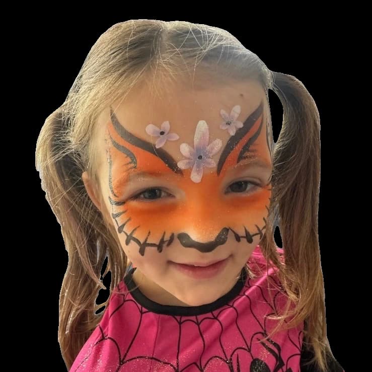 Child wearing an orange floral creature face painting design.