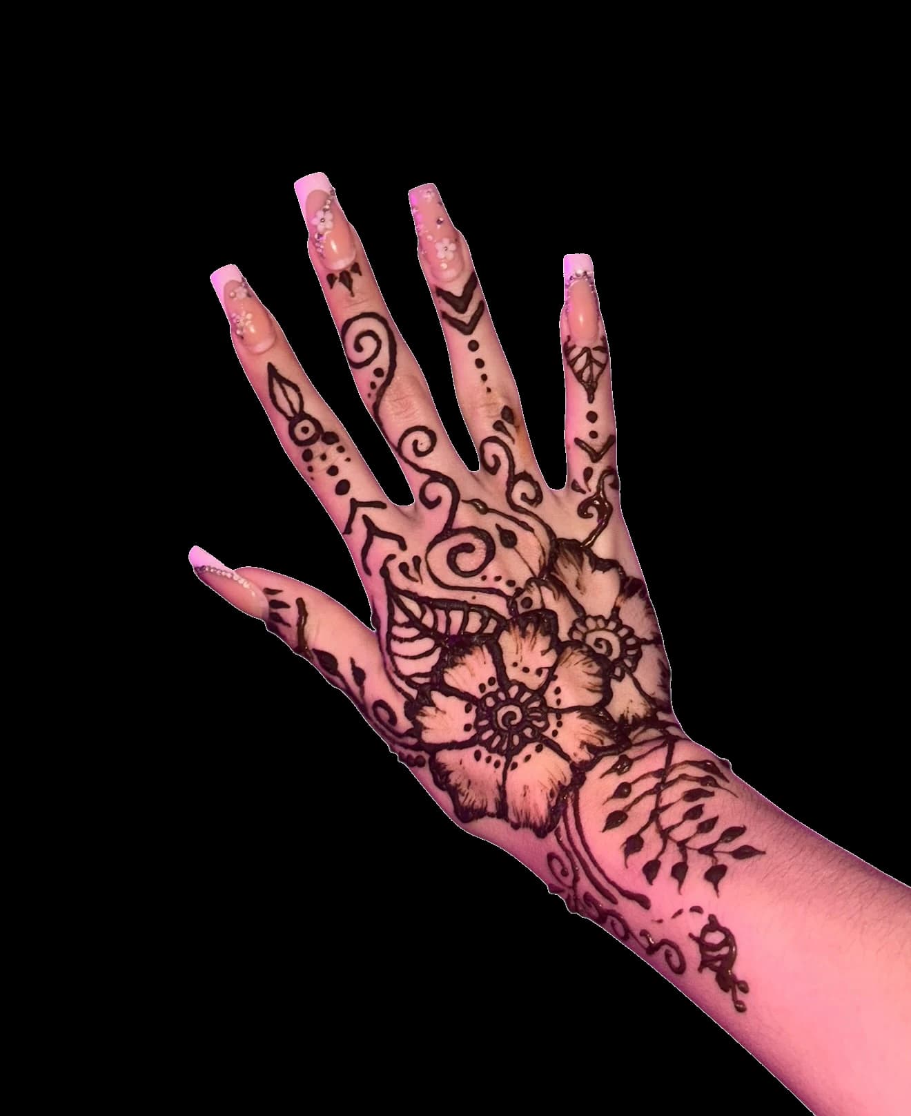 Floral henna design photographed under warm pink light.